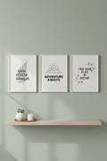 Three botanical inspirational wall art prints in white frames on sage green wall